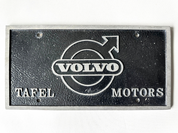Vintage Volvo sign with logo on a black background